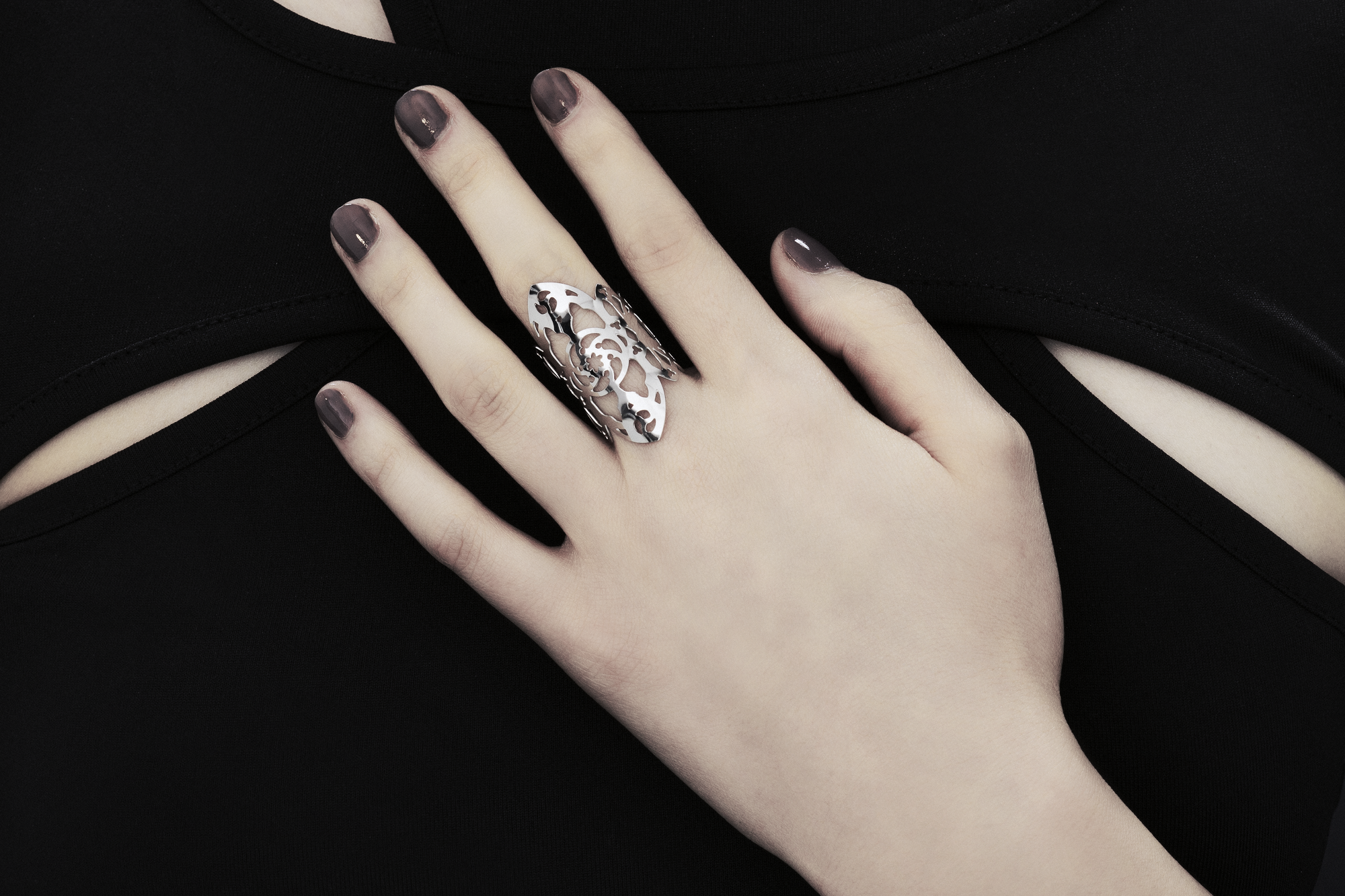 This exquisite Myril Jewels ring, handcrafted with a dark avant-garde flair, features detailed gothic-inspired motifs suitable for aficionados of alternative and gothic fashion. Designed with slender bands that evoke gothic arches, this piece exudes understated elegance. Handmade in Italy, these rings capture Myril Jewels' signature evolving style, crafted for those with a refined appreciation for gothic adornments.