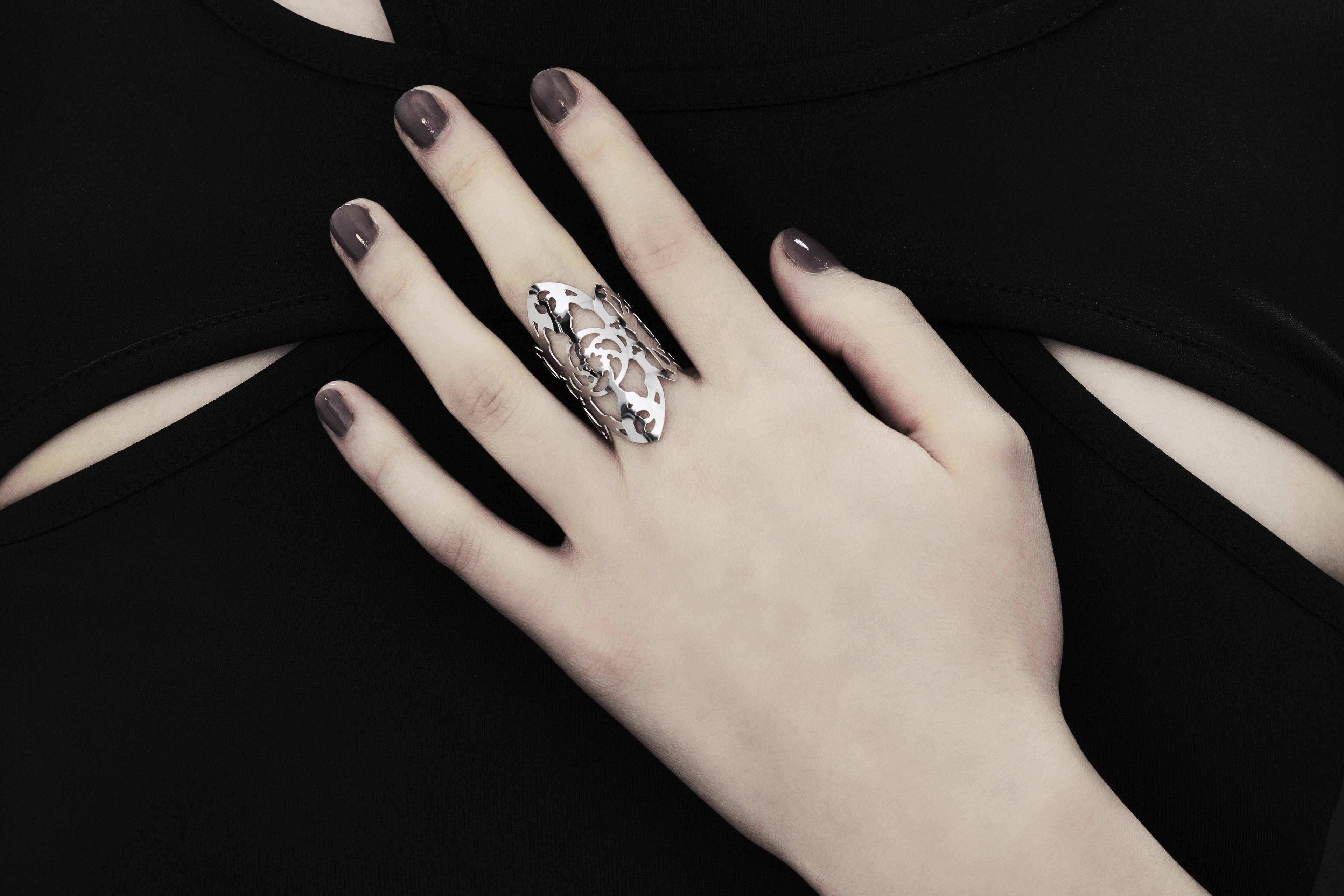 This exquisite Myril Jewels ring, handcrafted with a dark avant-garde flair, features detailed gothic-inspired motifs suitable for aficionados of alternative and gothic fashion. Designed with slender bands that evoke gothic arches, this piece exudes understated elegance. Handmade in Italy, these rings capture Myril Jewels' signature evolving style, crafted for those with a refined appreciation for gothic adornments.