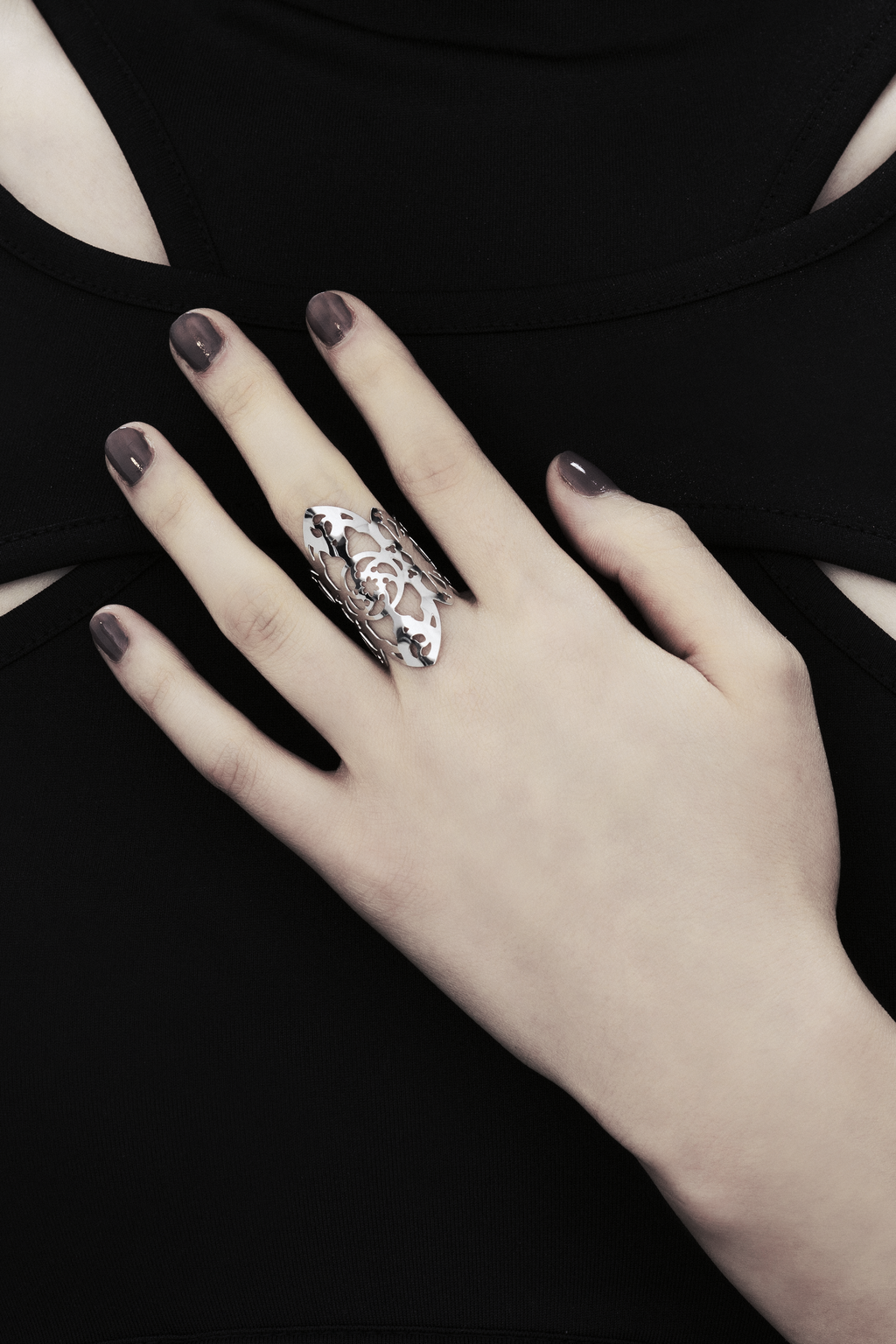  The showcased Myril Jewels ring, handcrafted with dark avant-garde sophistication, is adorned with elaborate gothic-inspired motifs. Each ring's slim band echoes the contours of gothic arches, offering a declaration of striking elegance. These Italian-crafted creations capture Myril Jewels' distinctive, ever-evolving aesthetic, designed for the refined preferences of gothic jewelry admirers.