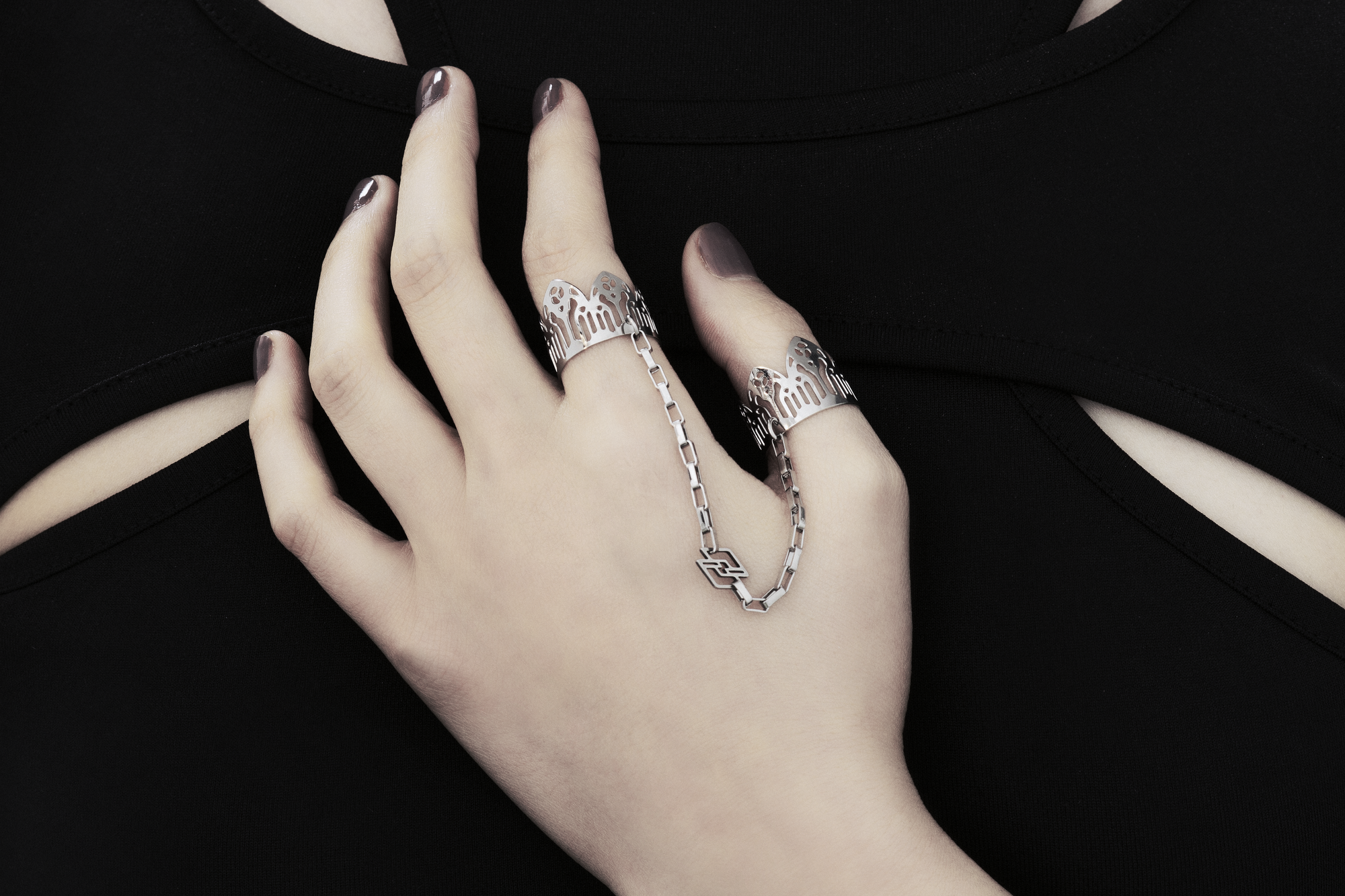 Featuring Myril Jewels' signature handcrafted flair, this double ring graces the hand with its gothic elegance, perfect for those with a penchant for alternative and gothic aesthetics. The slender band boasts gothic arch patterns, creating a distinctive statement of dark sophistication. Crafted in Italy, these rings capture the evolving sophistication of Myril Jewels, designed for the refined gothic jewelry aficionado.