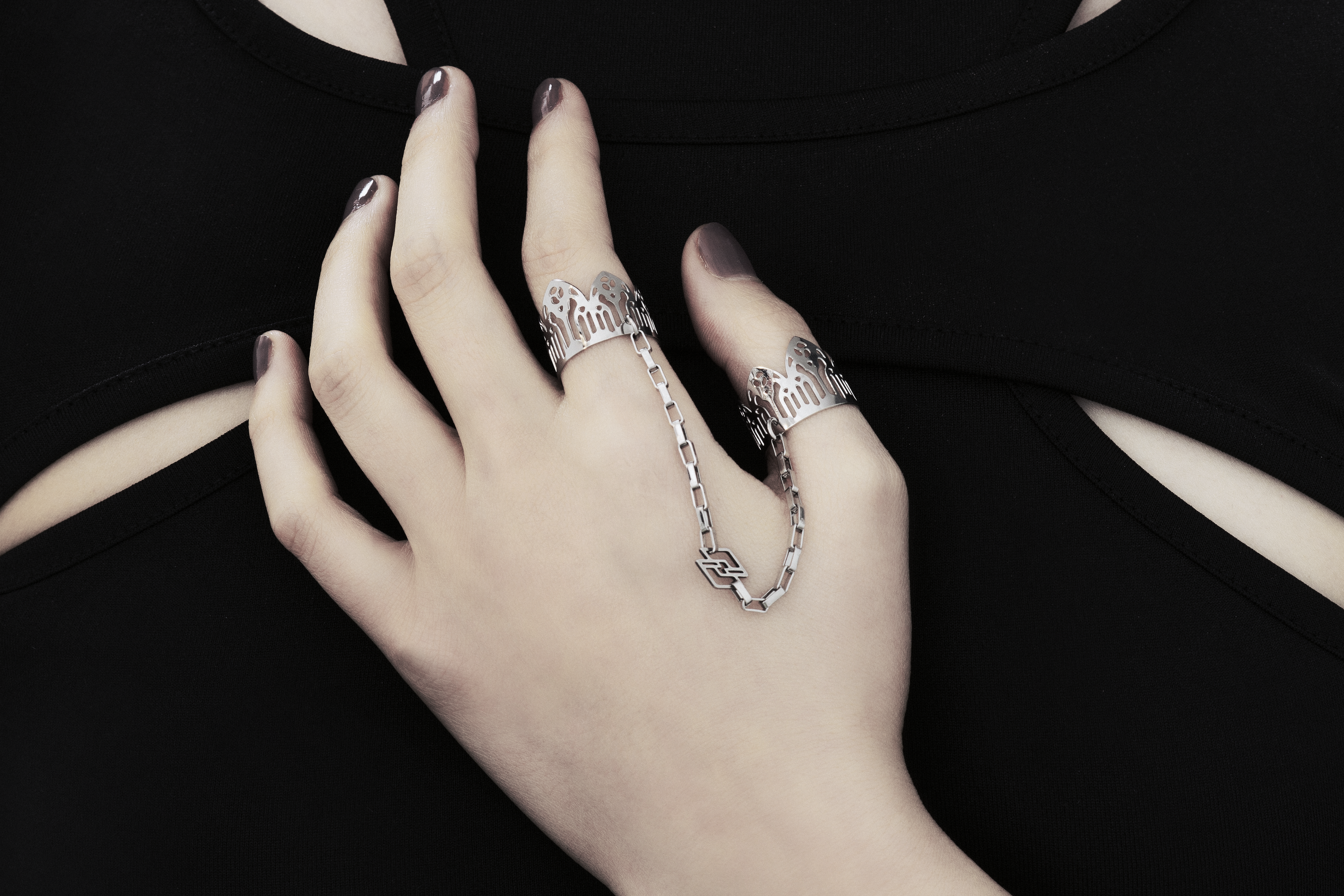 Featuring Myril Jewels' signature handcrafted flair, this double ring graces the hand with its gothic elegance, perfect for those with a penchant for alternative and gothic aesthetics. The slender band boasts gothic arch patterns, creating a distinctive statement of dark sophistication. Crafted in Italy, these rings capture the evolving sophistication of Myril Jewels, designed for the refined gothic jewelry aficionado.