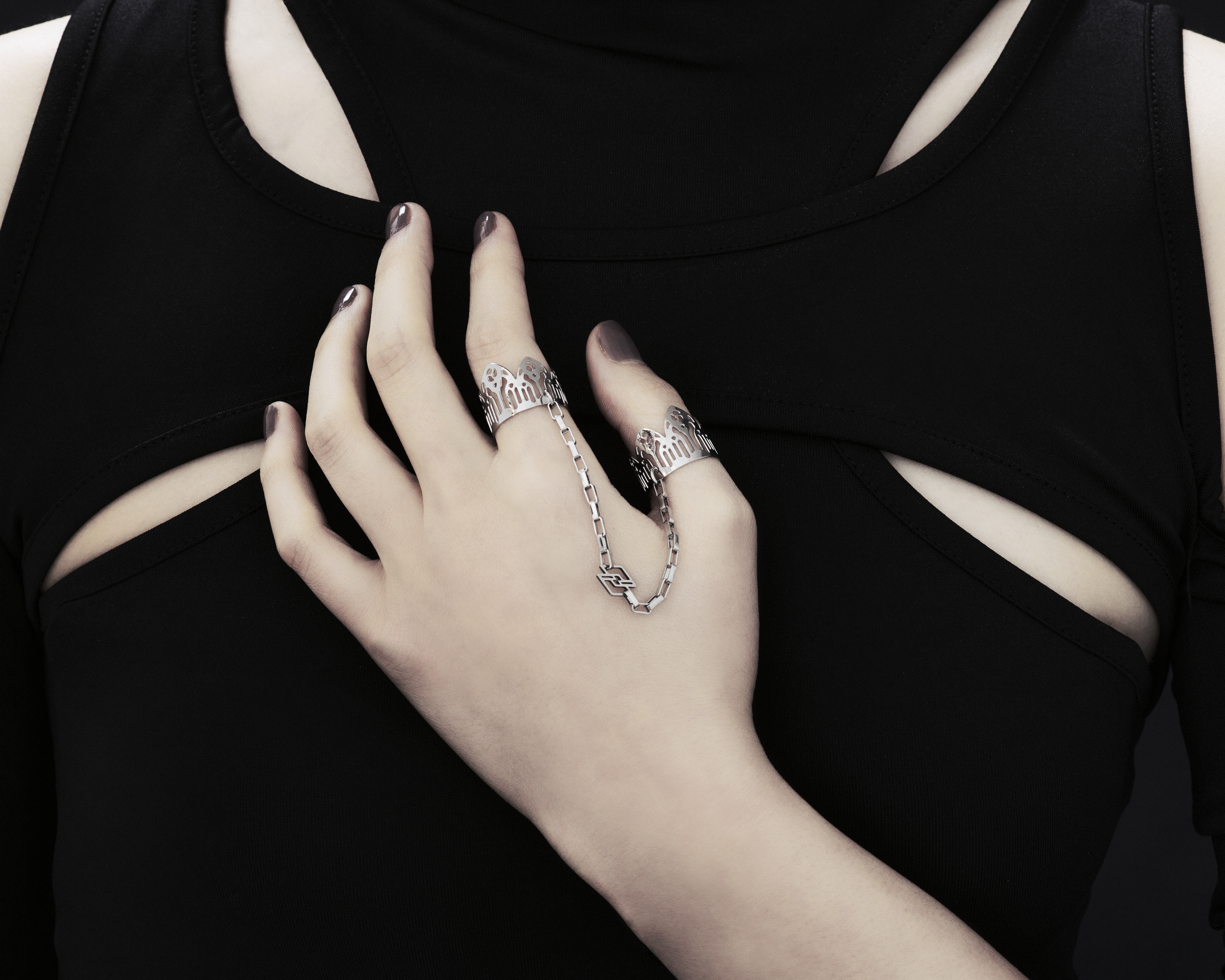 Featuring Myril Jewels' signature handcrafted flair, this double ring graces the hand with its gothic elegance, perfect for those with a penchant for alternative and gothic aesthetics. The slender band boasts gothic arch patterns, creating a distinctive statement of dark sophistication. Crafted in Italy, these rings capture the evolving sophistication of Myril Jewels, designed for the refined gothic jewelry aficionado.