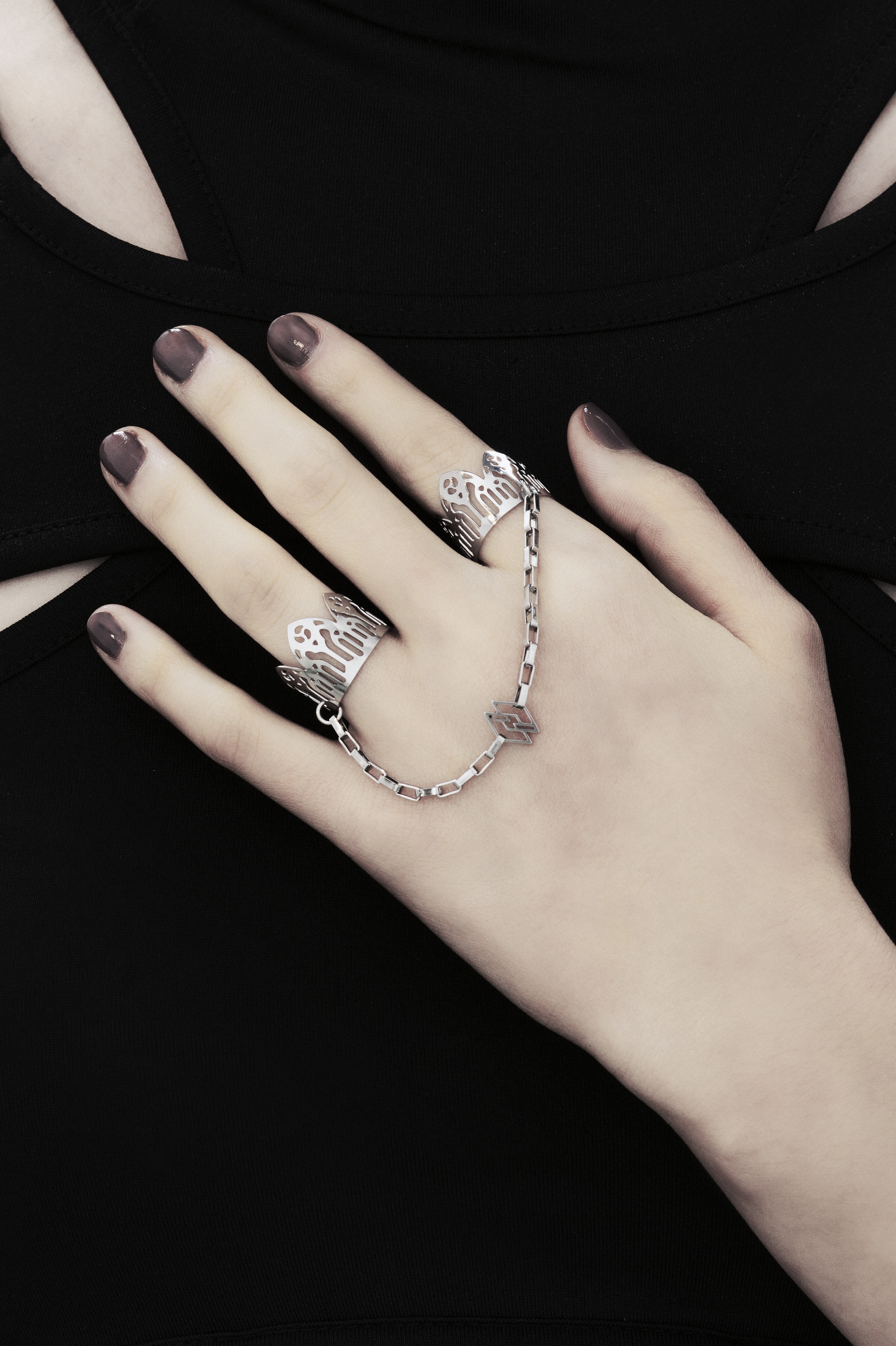 Featuring Myril Jewels' signature handcrafted flair, this double ring graces the hand with its gothic elegance, perfect for those with a penchant for alternative and gothic aesthetics. The slender band boasts gothic arch patterns, creating a distinctive statement of dark sophistication. Crafted in Italy, these rings capture the evolving sophistication of Myril Jewels, designed for the refined gothic jewelry aficionado.
