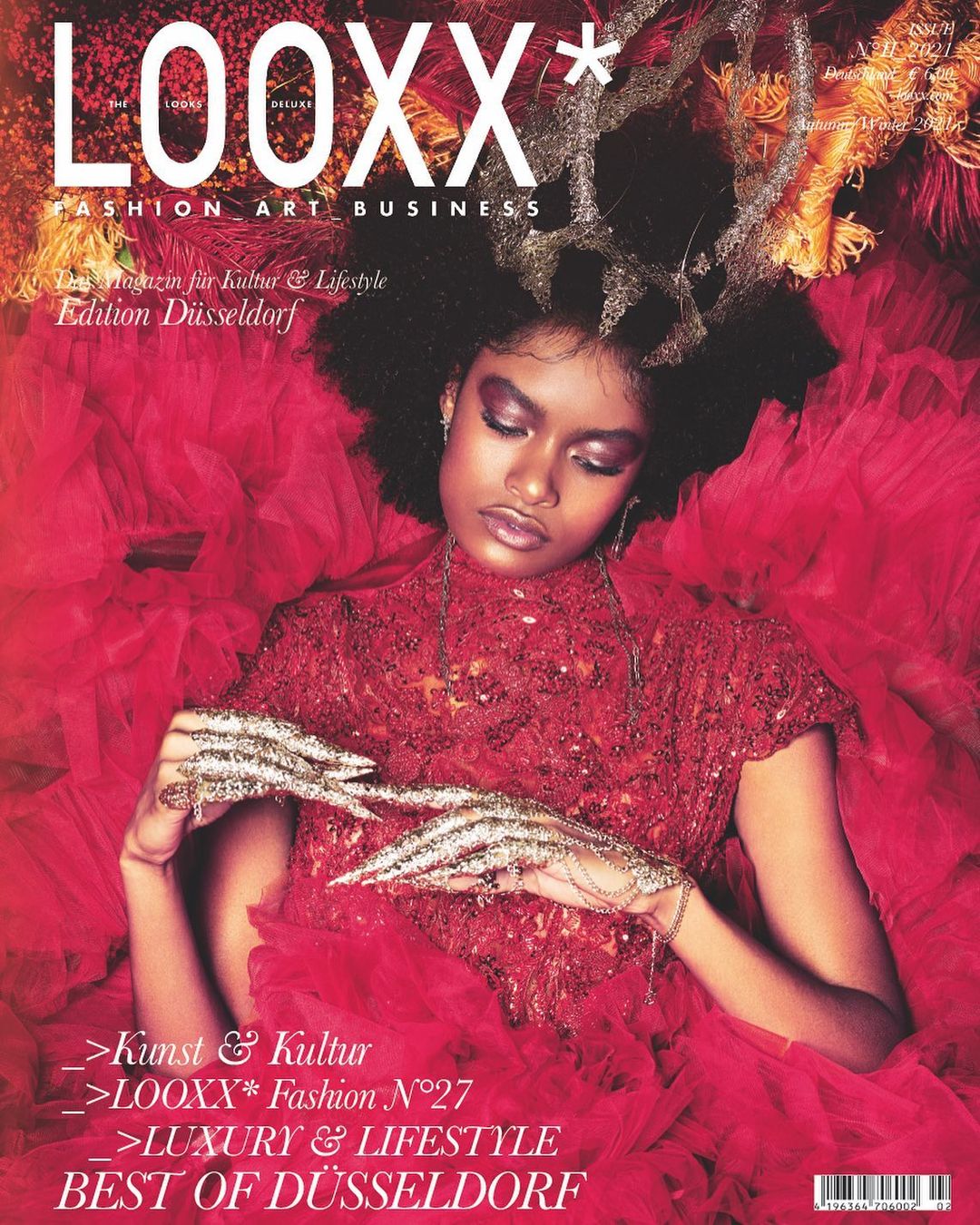 The cover of LOOXX* magazine features a model in a dramatic red ensemble, accentuated with Myril Jewels' signature full finger claw rings. The neo-gothic design brings a bold, avant-garde edge to the high fashion aesthetic, perfect for lovers of gothic-chic and standout Witchcore accessories.