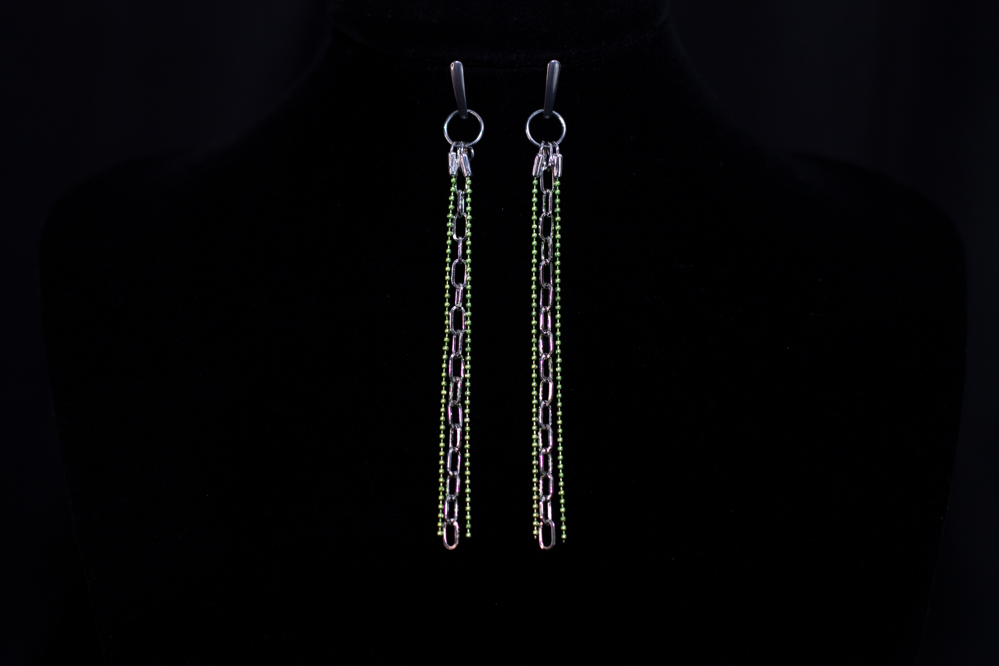 These Myril Jewels earrings showcase a neo-gothic allure, perfect for those embracing a dark-avantgarde style. The design features elongated chains adorned with shimmering green beads, reflecting an edgy yet chic aesthetic. Ideal for goth girlfriend gifts or as bold, festival-ready accessories, these earrings exude a minimalist goth vibe that complements both everyday wear and Halloween festivities.