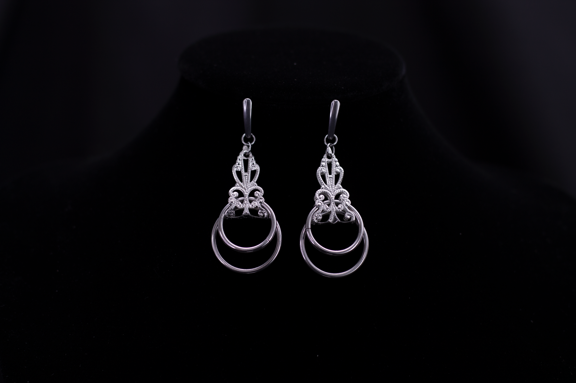 Showcase of Myril Jewels' mastery in dark-avantgarde jewelry, these silver Neo Gothic earrings displayed on a black velvet stand exude elegance and mystique. Perfect for individuals with a penchant for Gothic-chic, Whimsigoth, or Witchcore aesthetics, these earrings are ideal for daily wear or as a striking complement to Halloween jewelry collections