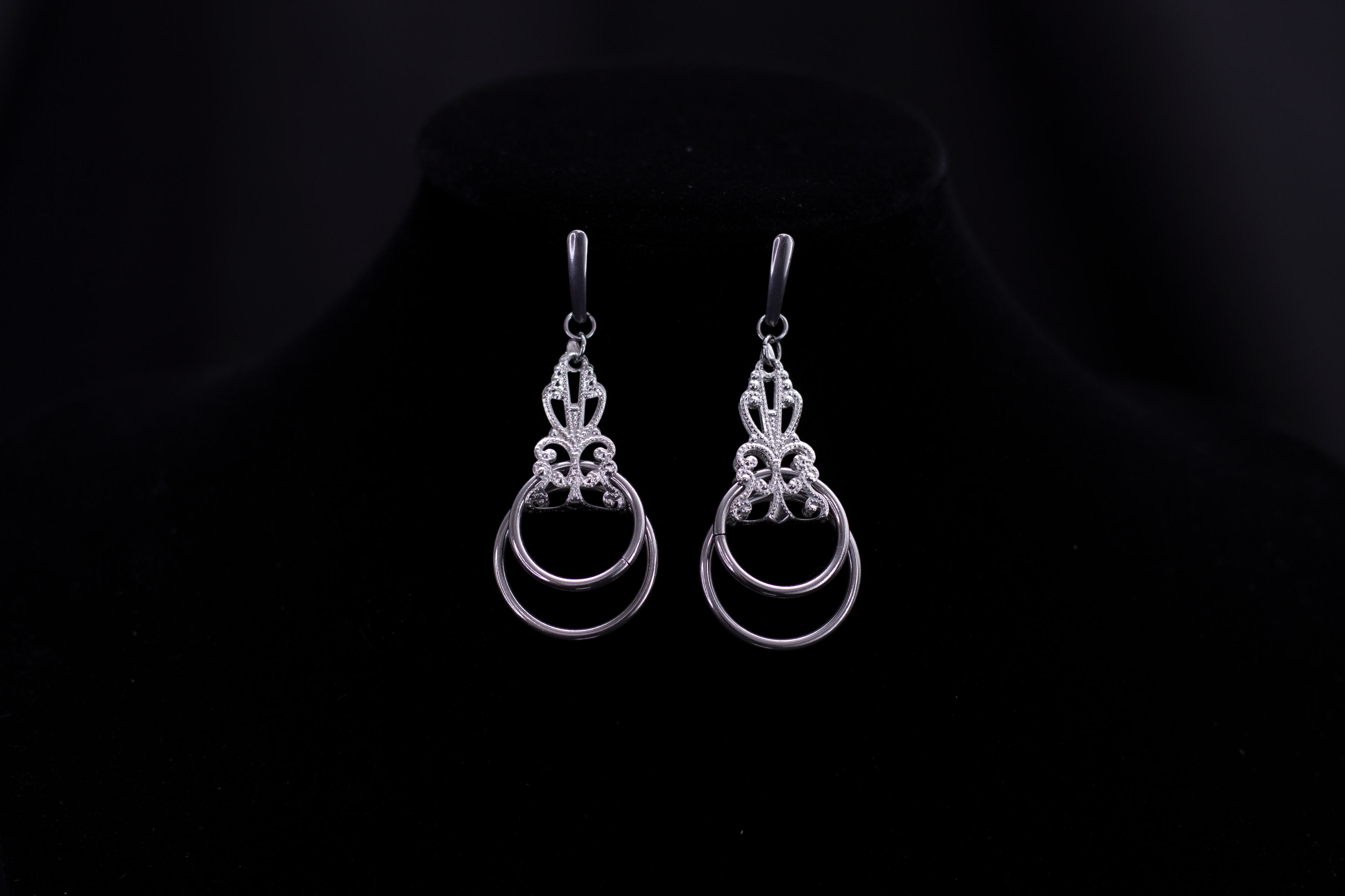 Showcase of Myril Jewels' mastery in dark-avantgarde jewelry, these silver Neo Gothic earrings displayed on a black velvet stand exude elegance and mystique. Perfect for individuals with a penchant for Gothic-chic, Whimsigoth, or Witchcore aesthetics, these earrings are ideal for daily wear or as a striking complement to Halloween jewelry collections