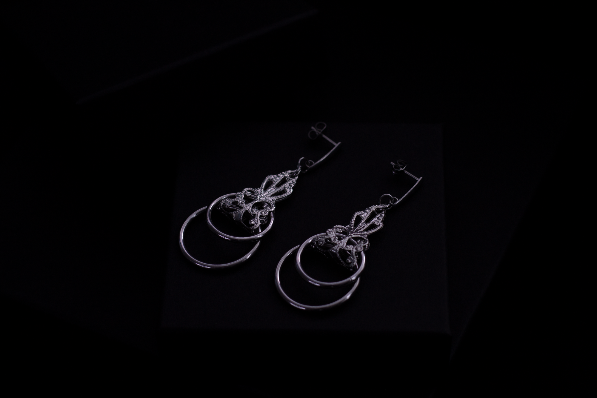 Display the dark elegance of Myril Jewels with these sterling silver Neo Gothic earrings, presented on a black background for a striking contrast. Ideal for those with a penchant for Gothic-chic, Punk, or Witchcore aesthetics, these earrings from Myril Jewels are a versatile addition to any Halloween Jewelry collection or everyday wear with a sophisticated, alternative twist