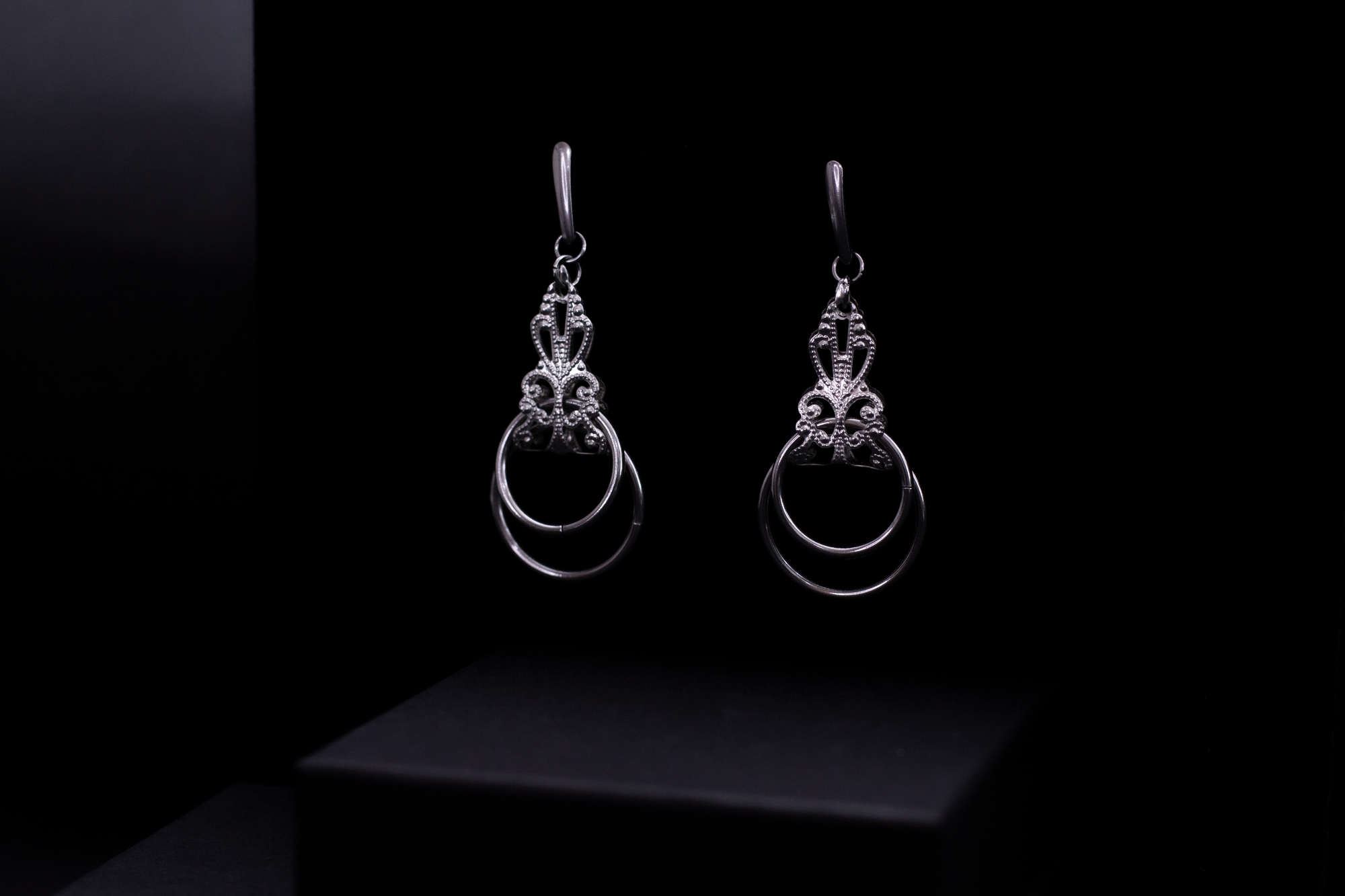 Myril Jewels presents a pair of silver Neo Gothic earrings, elegantly displayed against a dark backdrop, embodying the brand’s dark-avantgarde essence. Perfect for Gothic-chic, Punk, or everyday wear, these earrings are a versatile addition to any Halloween Jewelry collection or Witchcore wardrobe, meticulously handcrafted in Italy for a unique statement