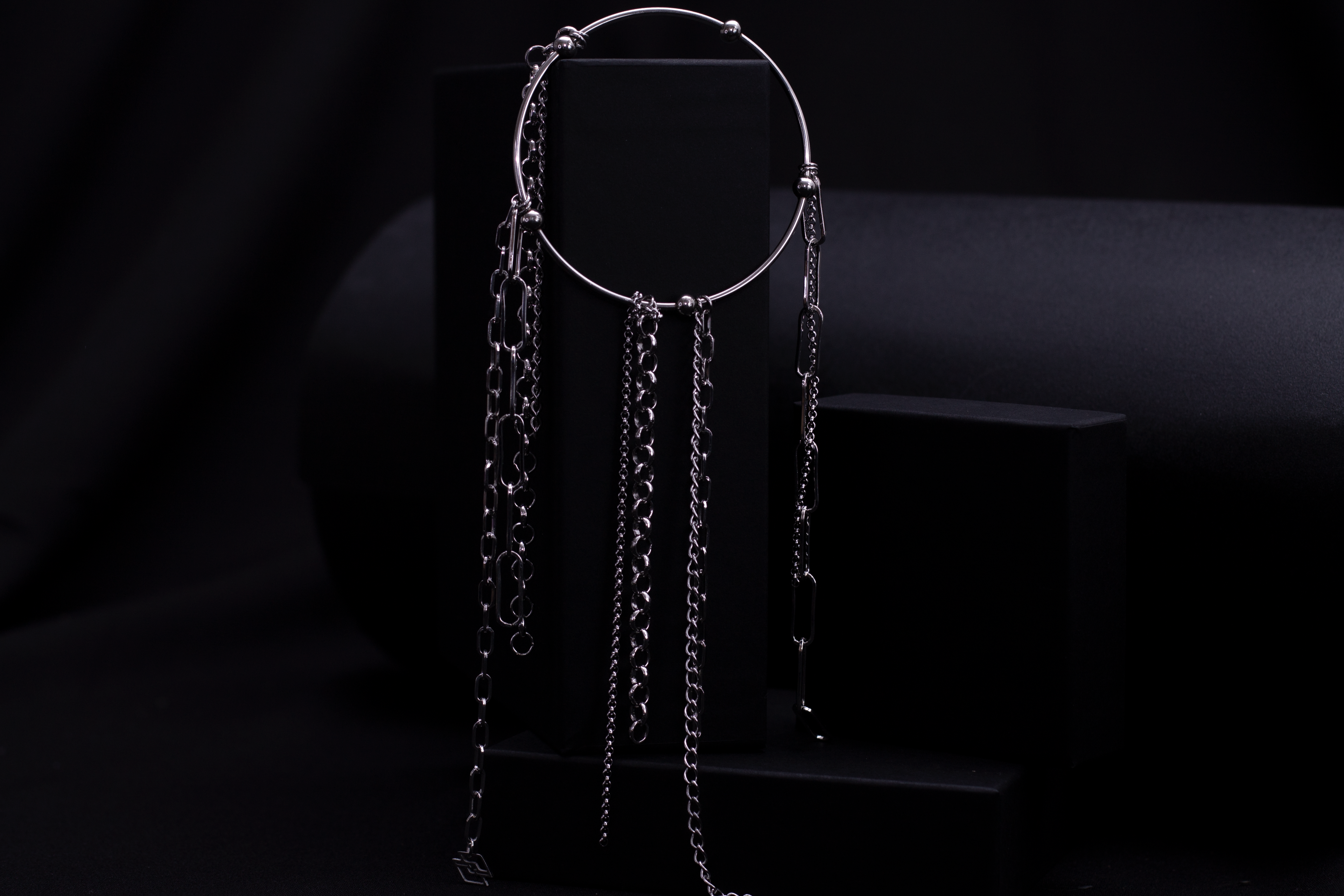 Discover Myril Jewels' neo-goth rigid bracelet with cascading chains, ideal for gothic connoisseurs seeking dark, avant-garde accessories for any edgy ensemble