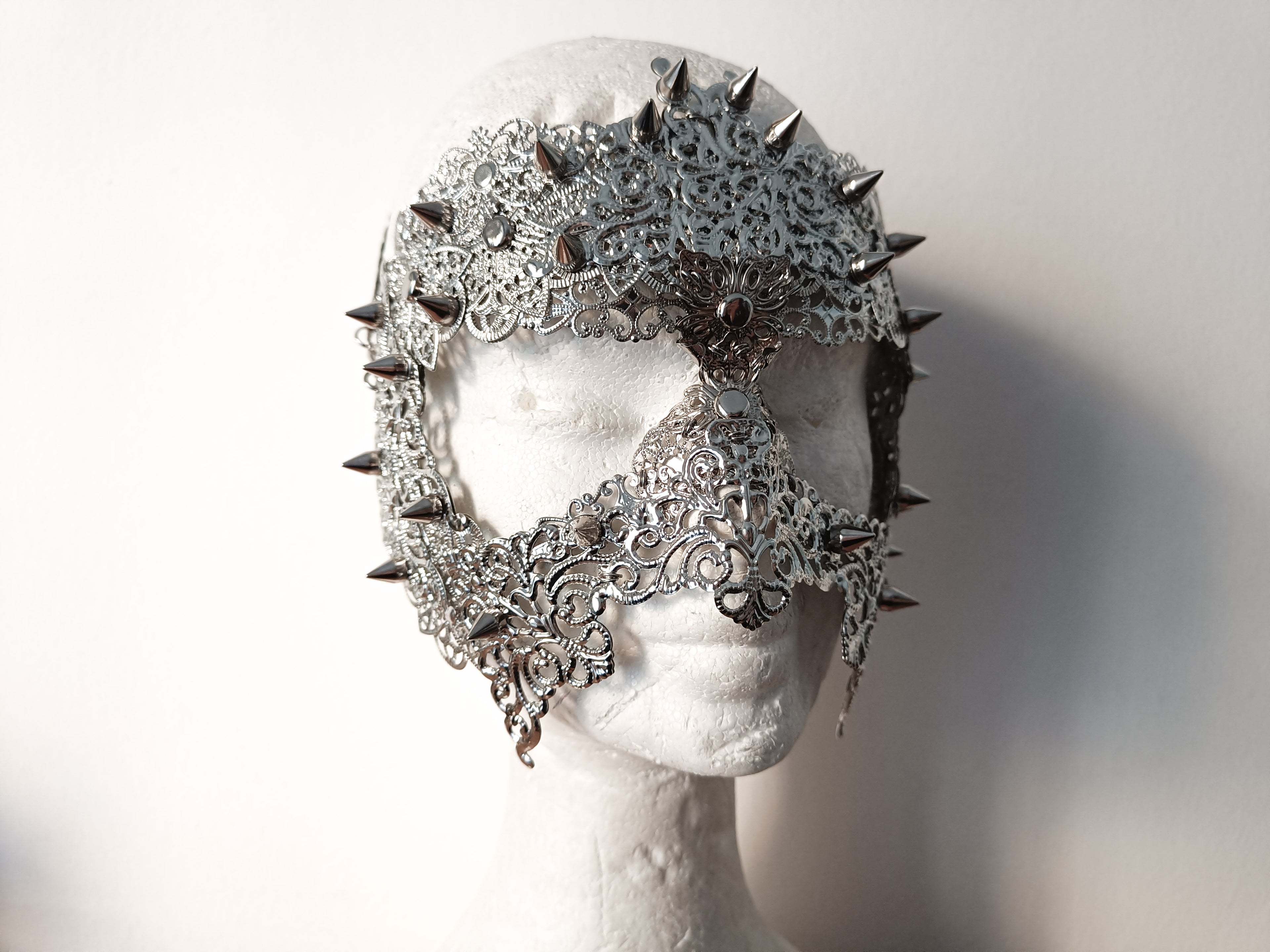 Myril Jewels full-face filigree mask adorned with studs, embodying punk and neo-gothic style. This piece is a statement of dark-avantgarde fashion, perfect for Halloween, rave parties, or as a dramatic goth girlfriend gift.