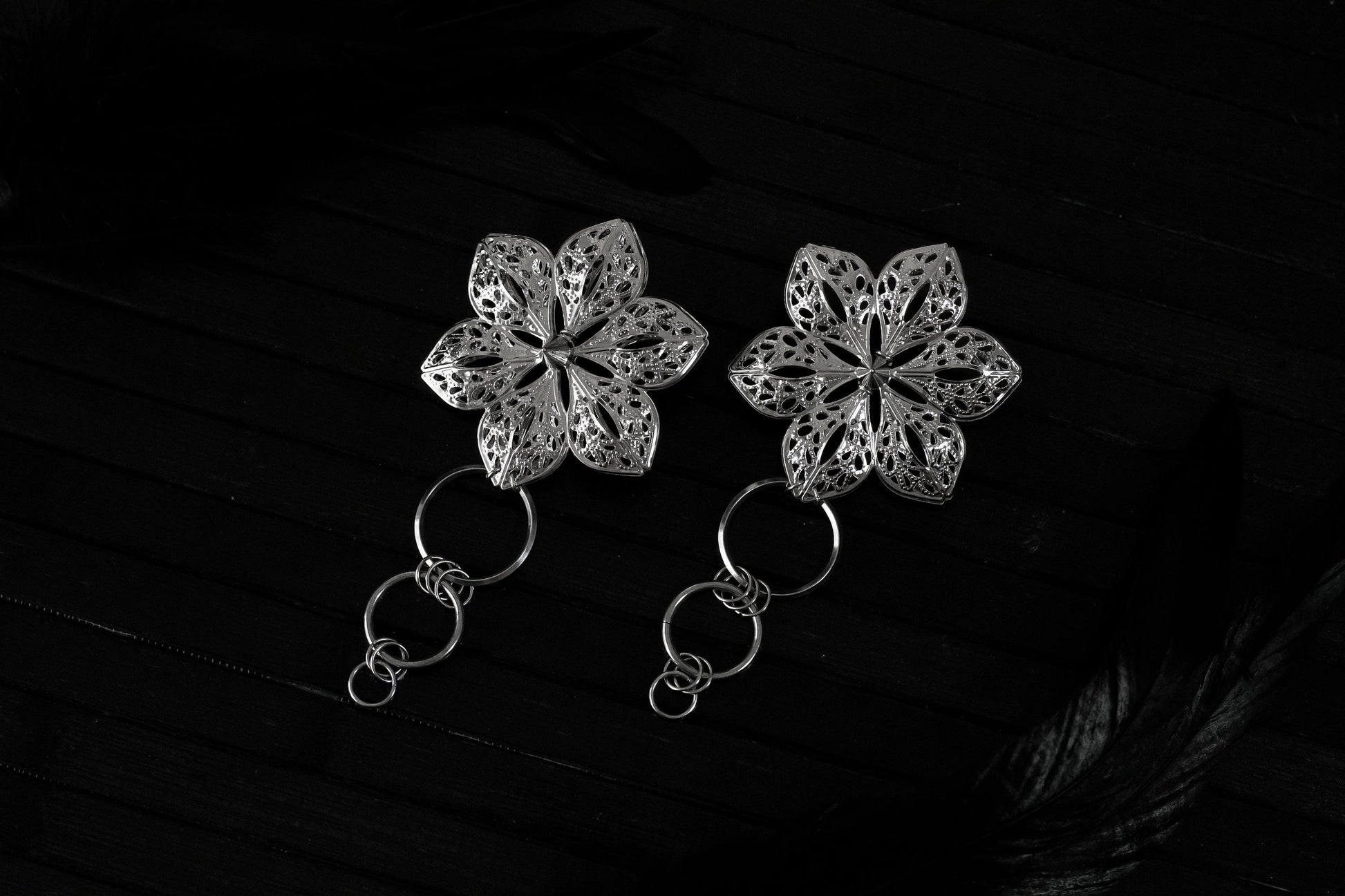 Showcase your unique style with Myril Jewels' punk studded floral earrings, a fusion of dark avant-garde and gothic chic. These handcrafted pieces are perfect for those who admire Neo Gothic elegance and seek a bold accessory for Halloween, whimsigoth, or witchcore attire. With their intricate design, these earrings are also ideal for adding a touch of everyday wear sophistication to any minimal goth wardrobe
