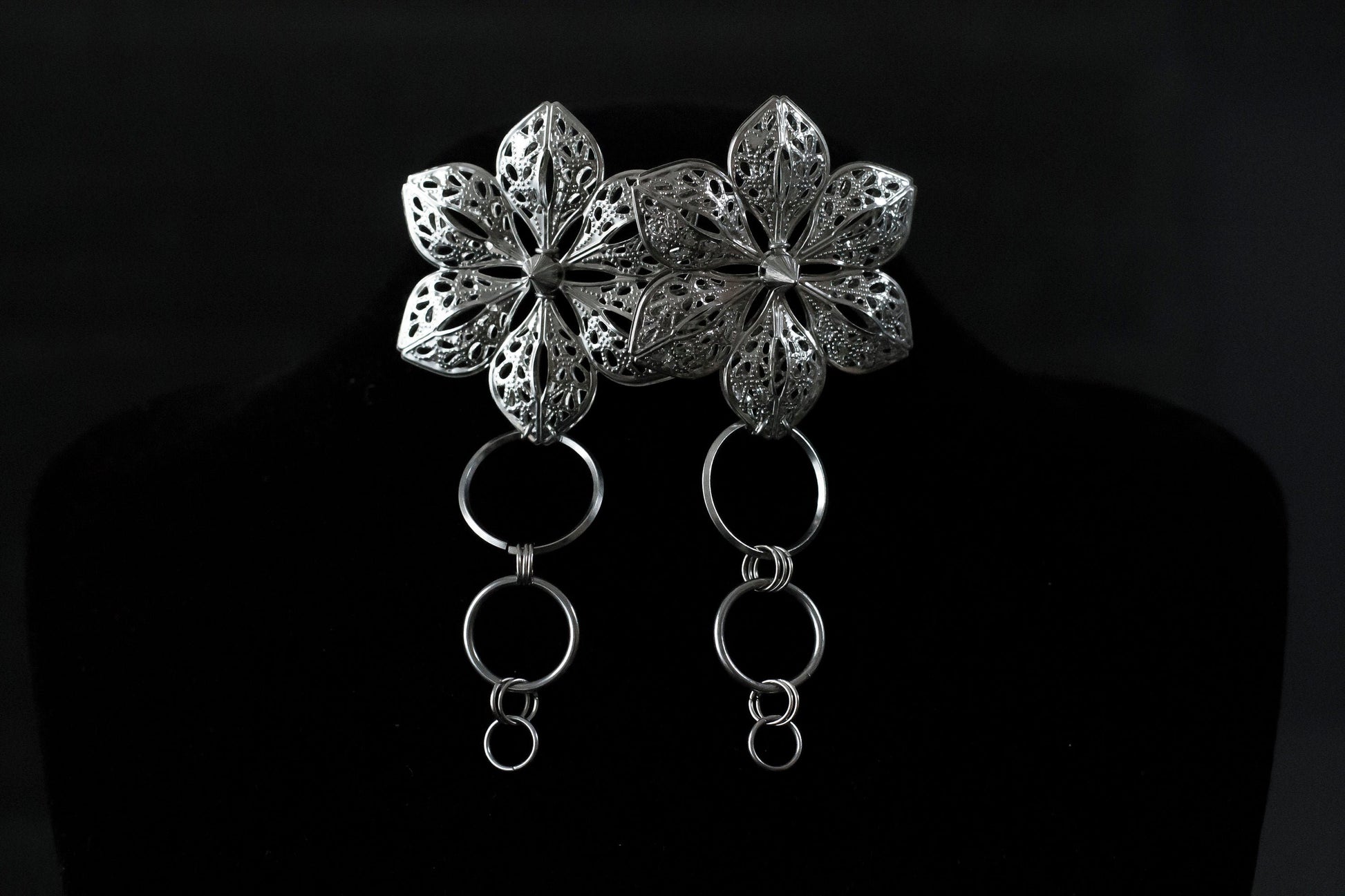 Stand out with Myril Jewels' handcrafted punk studded floral earrings, where dark avant-garde meets sophisticated design. Ideal for gothic and alternative style aficionados, these earrings are a testament to the brand's Neo Gothic roots, perfect for enhancing Gothic Lolita, Gothic-chic, or whimsigoth looks. They're also a captivating choice for Halloween jewelry or adding an elegant witchcore touch to everyday minimal goth outfits