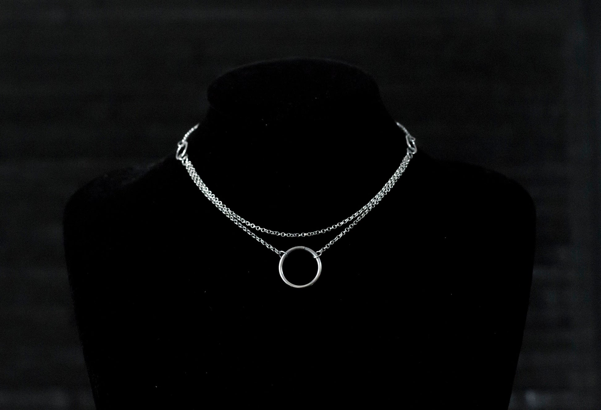 Elegant Myril Jewels chain necklace featuring a minimalist o-ring, ideal for the discerning goth. Perfect for Halloween or everyday wear, this piece blends dark-avantgarde style with subtle punk undertones, making it a unique goth girlfriend gift or a bold addition to a festival ensemble.