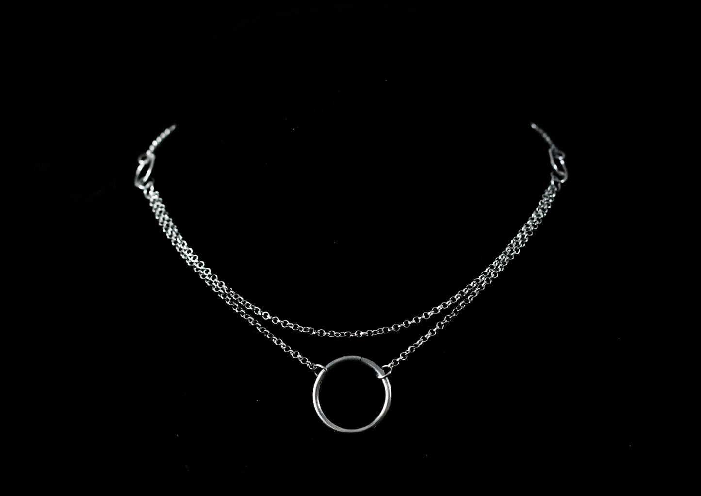 Elegant Myril Jewels necklace featuring a minimalist o-ring centerpiece, capturing the essence of neo-gothic chic. Ideal for those embracing a dark avant-garde or whimsigoth style, perfect as a bold statement piece for everyday wear or as a distinctive goth girlfriend gift.