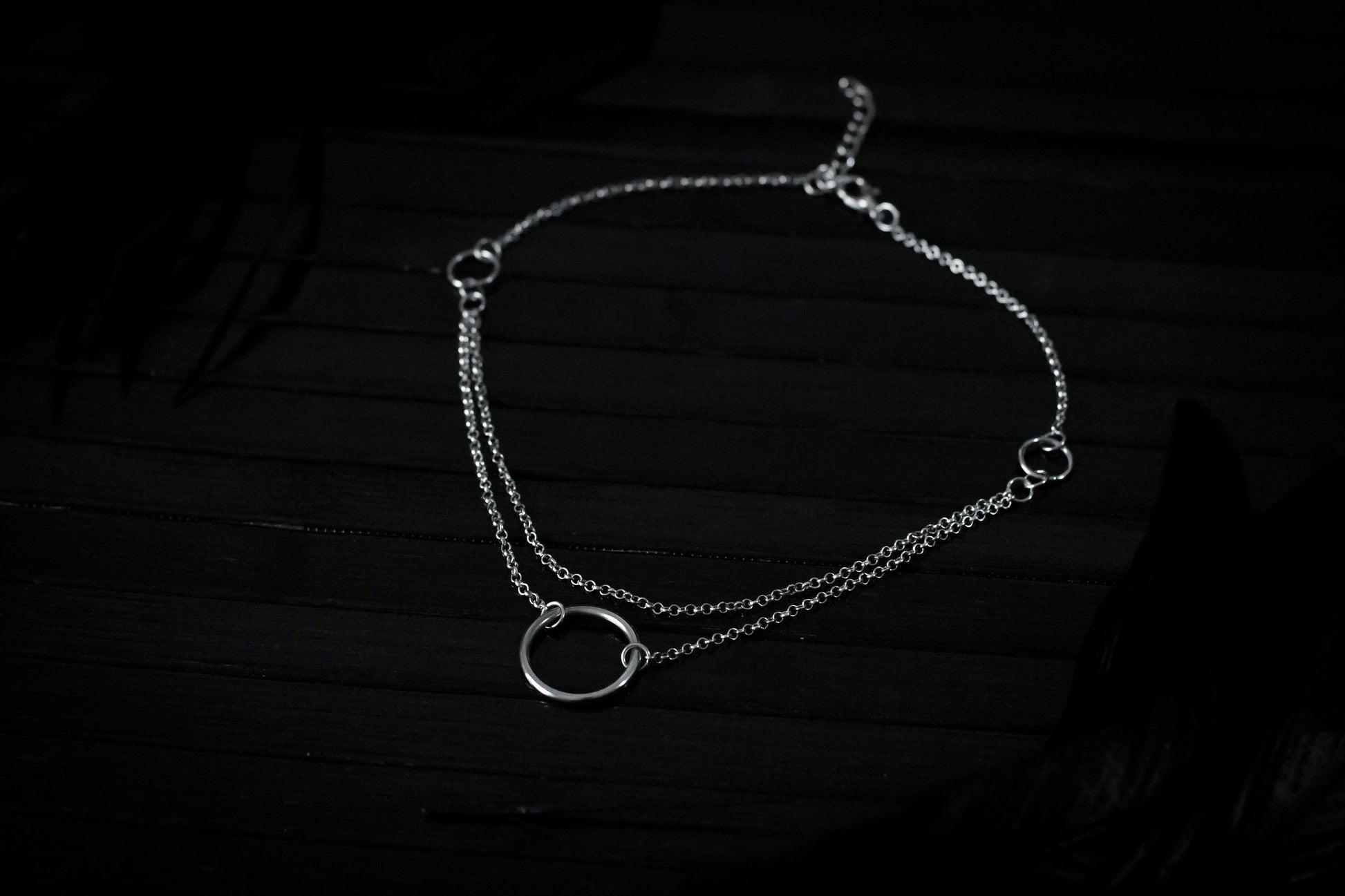Elegant Myril Jewels chain necklace, featuring a prominent central o-ring, embodies the essence of neo-gothic charm. Designed for goth and alternative style connoisseurs, this piece serves as a versatile accessory for everyday wear or as a bold statement for festival and rave attire. Perfect for those seeking a touch of Halloween or Punk Jewelry, it's an ideal goth girlfriend gift or a distinctive friend gift idea.