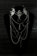 Myril Jewels presents an exquisite punk studded metal choker paired with a multi-layer long chain necklace, embodying the dark avant-garde spirit. This Italian handcrafted ensemble is a testament to the fusion of Neo Gothic flair and Gothic-chic, perfect for Halloween, everyday wear, or any whimsigoth and witchcore inspired look. The layered chains add depth to the minimal goth aesthetic, making it a versatile statement piece for alternative style connoisseurs