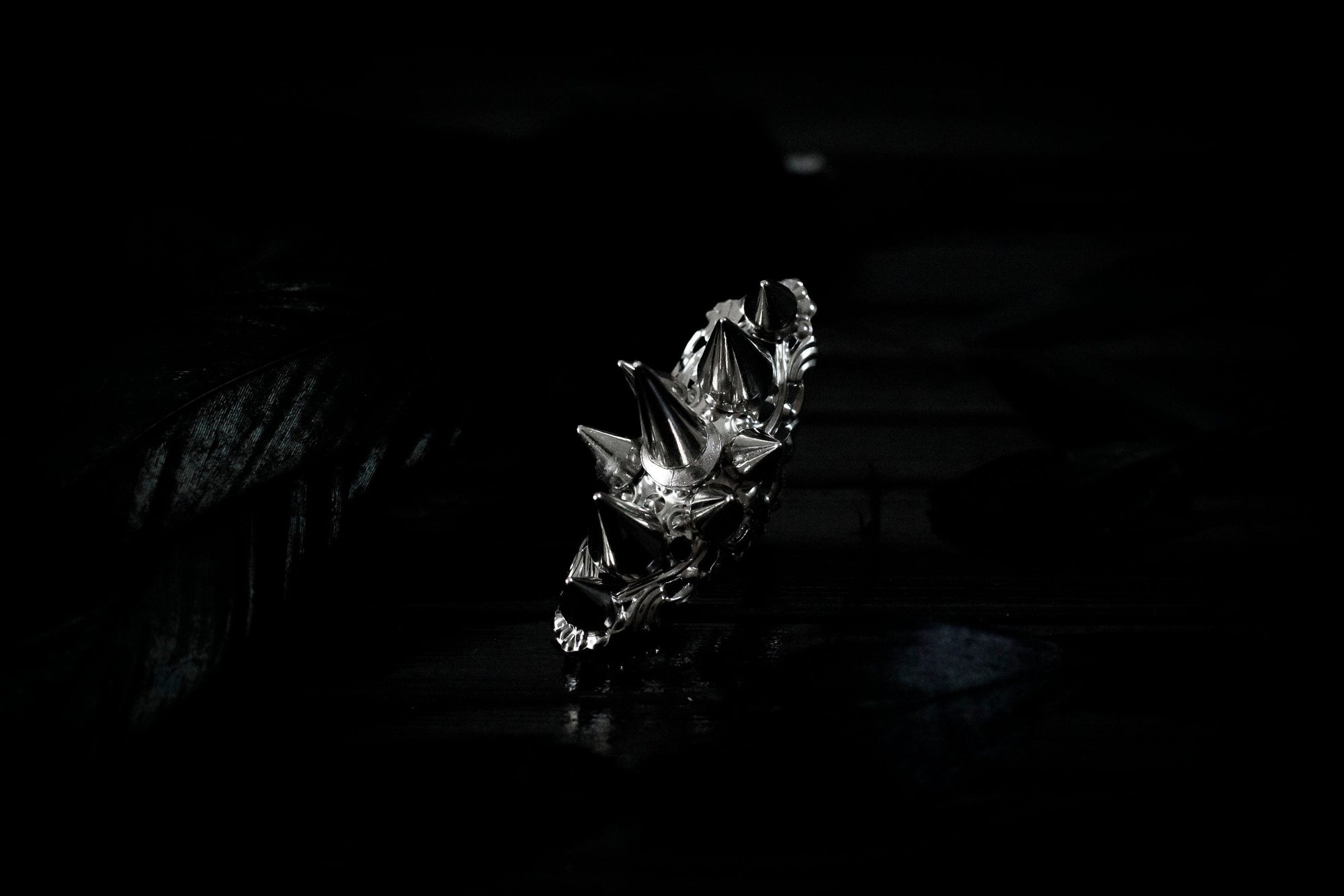 This bold Myril Jewels punk studded ring stands out with its gleaming silver spikes and intricate filigree detailing that pays homage to Neo Gothic craftsmanship. Perfect for anyone seeking a statement piece that channels Gothic-chic or Witchcore vibes, the ring is a quintessential accessory for Halloween, dramatic everyday wear, and a striking complement to any minimal goth or Whimsigoth inspired outfit.