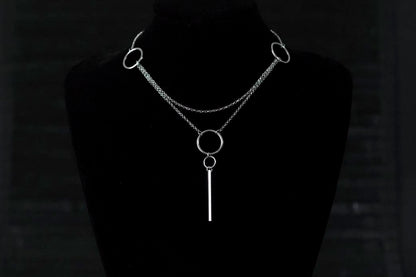 Myril Jewels presents a sophisticated minimal chain necklace featuring clean lines and interlinked hoops, reflecting a modern take on neo-gothic style, perfect for versatile everyday wear or as a statement piece for avant-garde fashion enthusiasts.