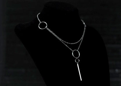 A Myril Jewels minimal chain necklace displayed on a black backdrop, featuring simple hoops for a refined neo-goth aesthetic, suitable for gothic-chic fashion connoisseurs.