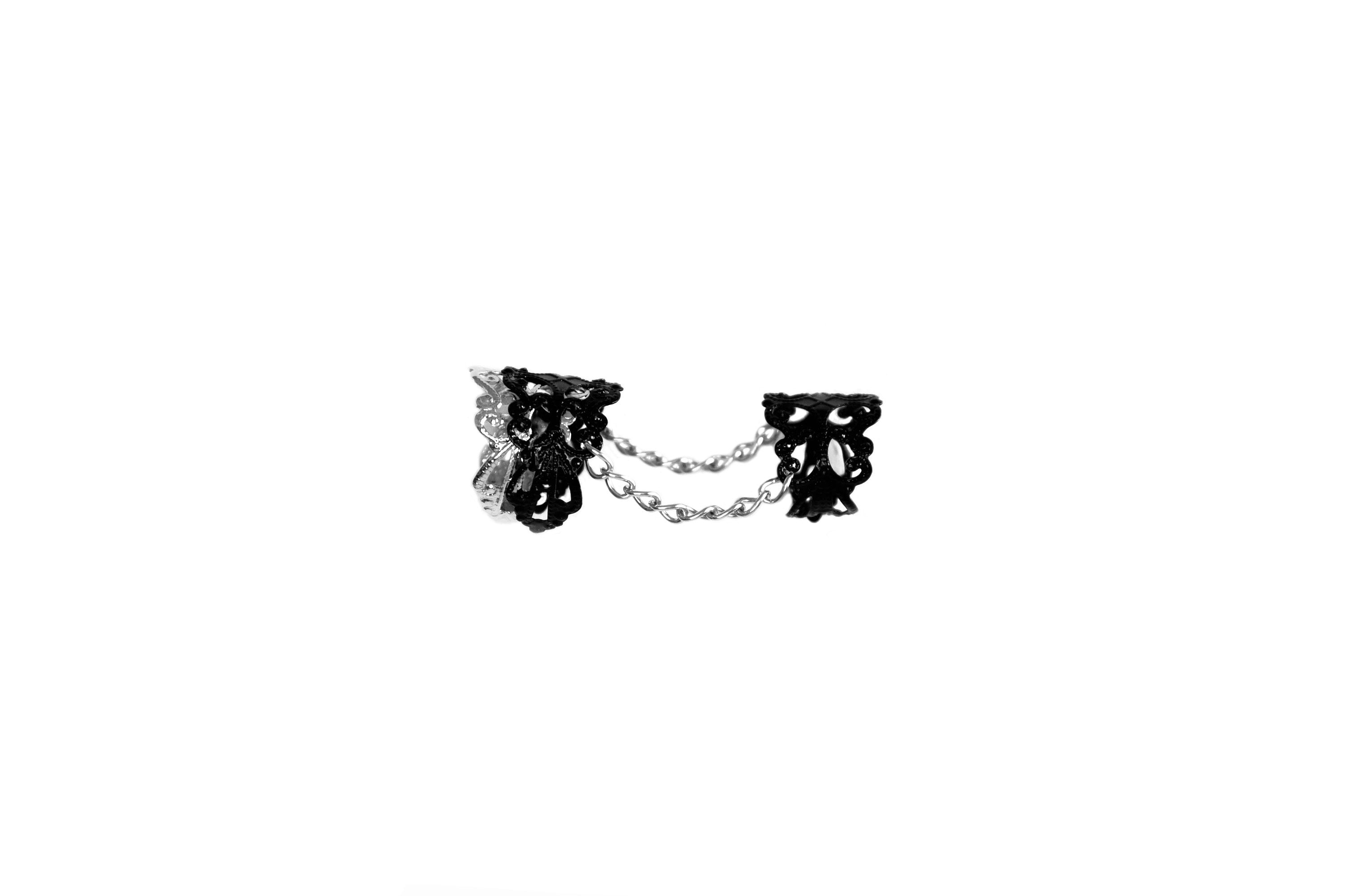 A Myril Jewels goth double ring, intricately designed for a bold, neo-gothic statement. Ideal for Halloween or as a distinctive everyday accessory, this piece captures the essence of gothic-chic and is a perfect gift for the alternative style enthusiast.