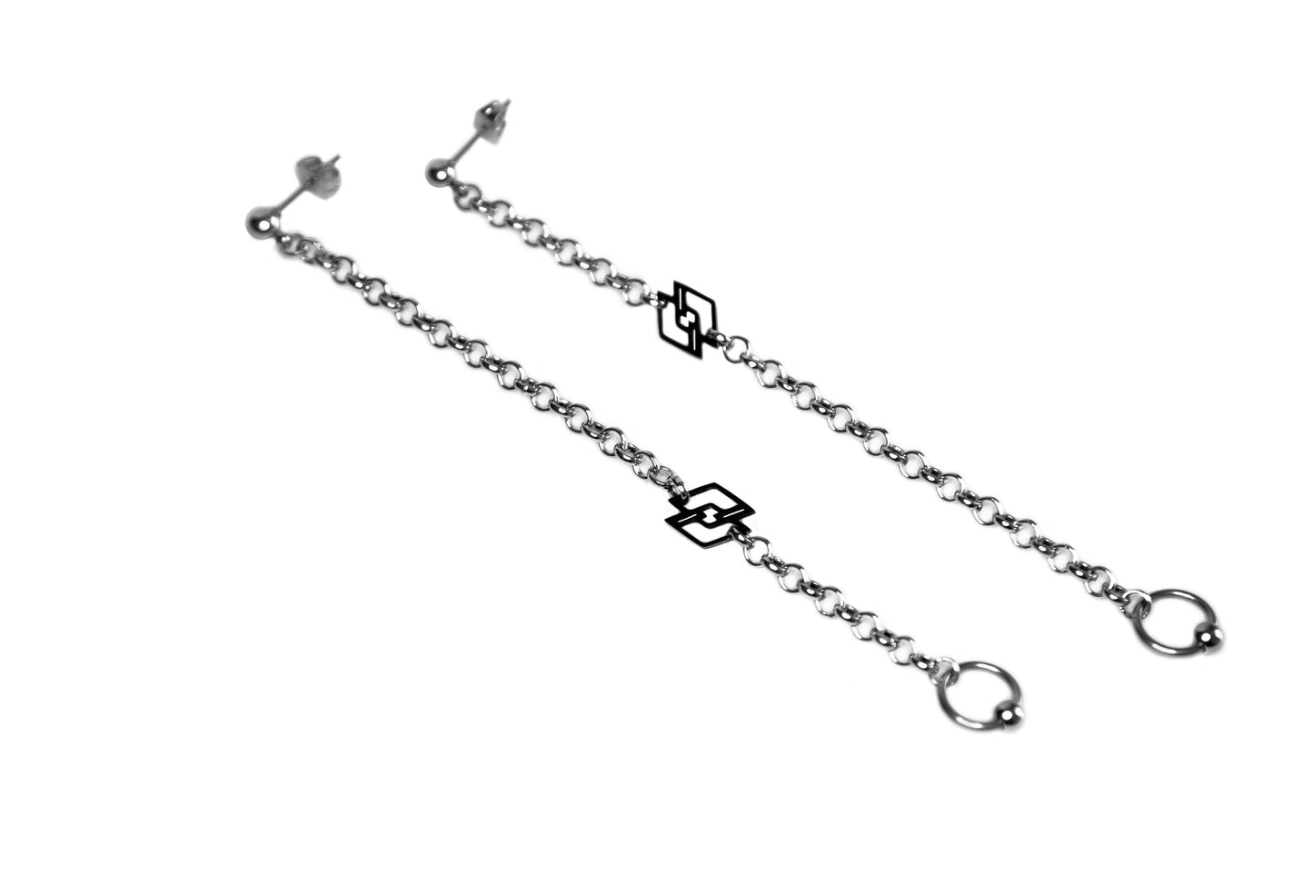 Embrace the essence of dark sophistication with Myril Jewels' long chain earrings, featuring the iconic black Myril logo. These pieces capture the spirit of neo-gothic allure, ideal for punk and whimsigoth fashion statements, and seamlessly transition from everyday minimal goth to rave party extravagance
