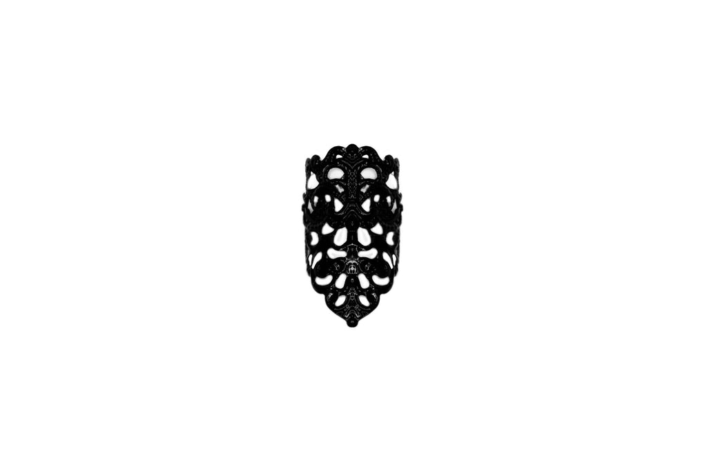 Presenting Myril Jewels' goth midi ring, a masterful expression of dark-avantgarde artistry. This neo-gothic jewel showcases an elaborate, blackened metalwork with an openwork pattern that mimics the intricate beauty of natural forms. Its bold yet intricate design captures the essence of gothic-chic, making it an ideal accessory for those drawn to the enigmatic world of whimsigoth and witchcore. Designed for everyday wear, this midi ring is also perfect for accenting Halloween costumes